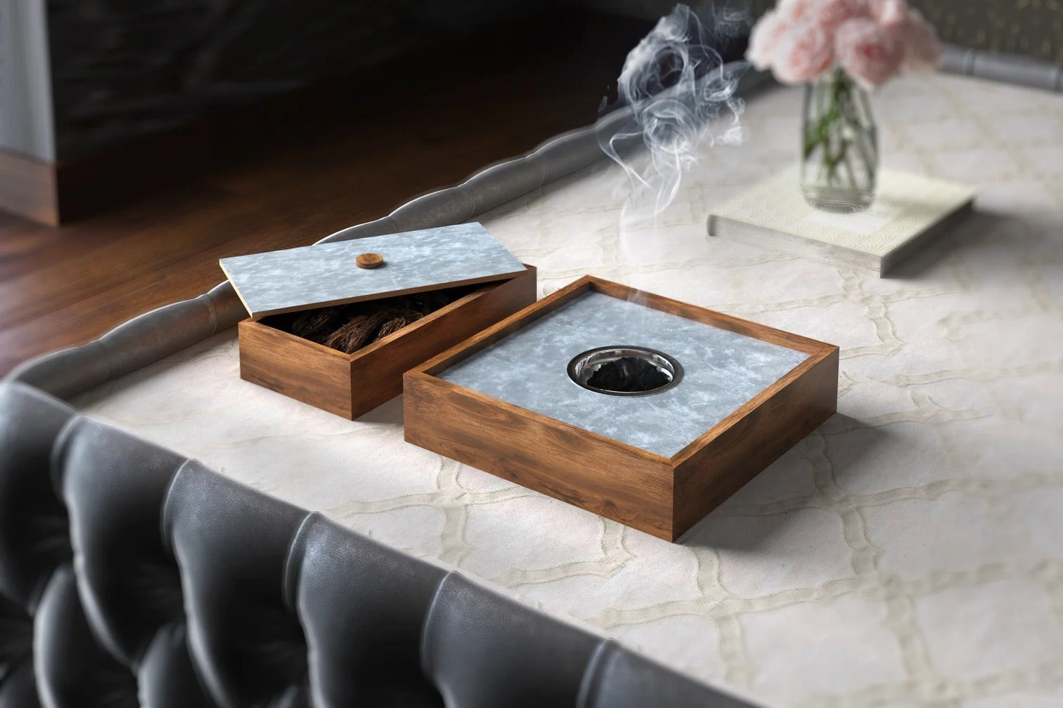 Wooden incense burner with smoke on a marble surface